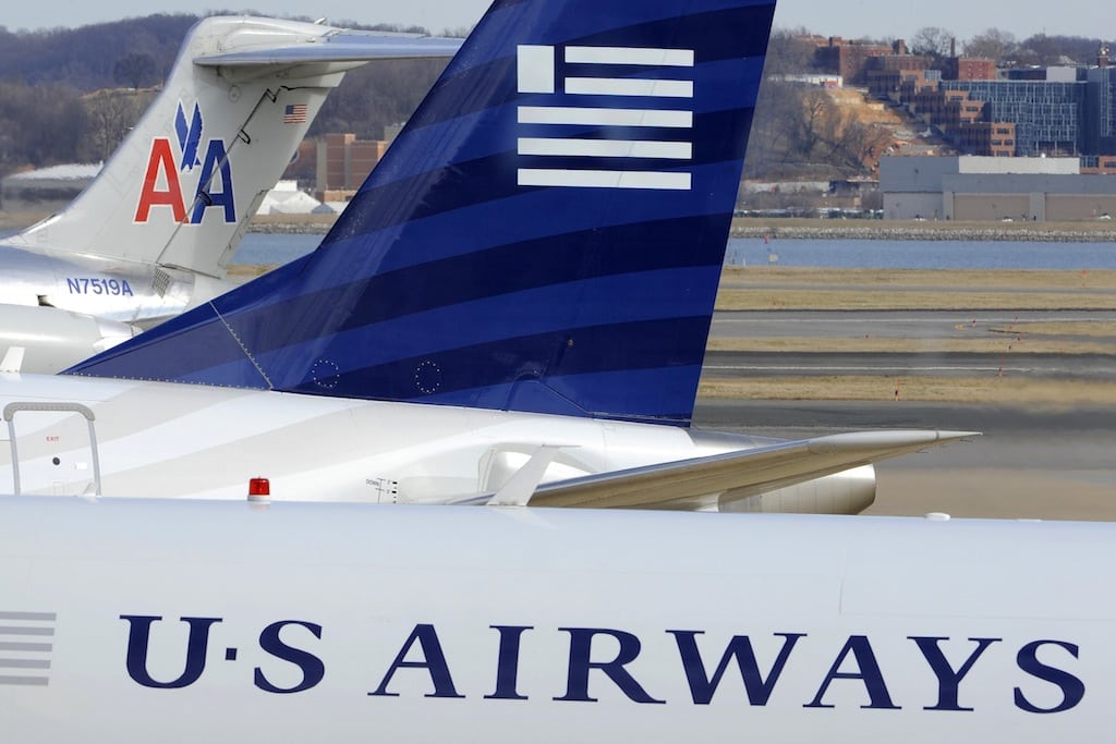 A view of two US Airways Express planes next to an American Airlines plane (background) at the Ronald Reagan Washington National Airport in Arlington County, Virginia, February 10, 2013. 