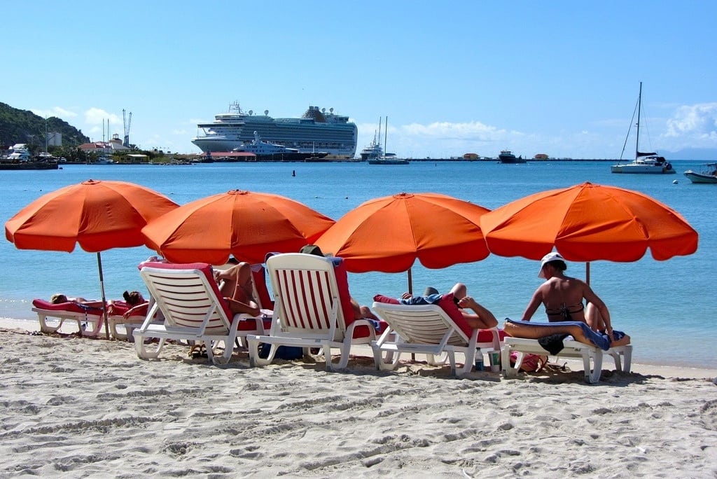 Tourists tan at Great Bay Beach on the island of Saint Martin in the Caribbean.  