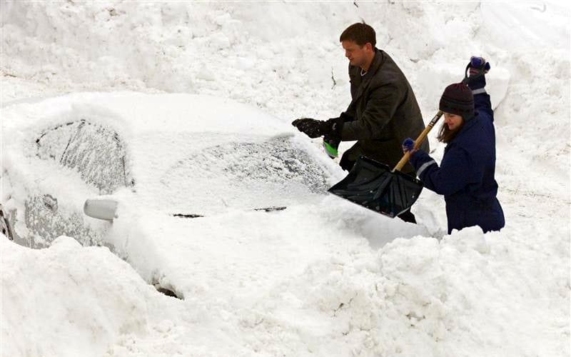 Residents of the Boston suburb of Medford, Massachusetts dig their cars out of the snow in this file picture. 