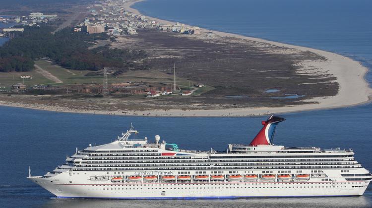 The Carnival Triumph cruise ship is towed towards the port of Mobile, Alabama earlier today.