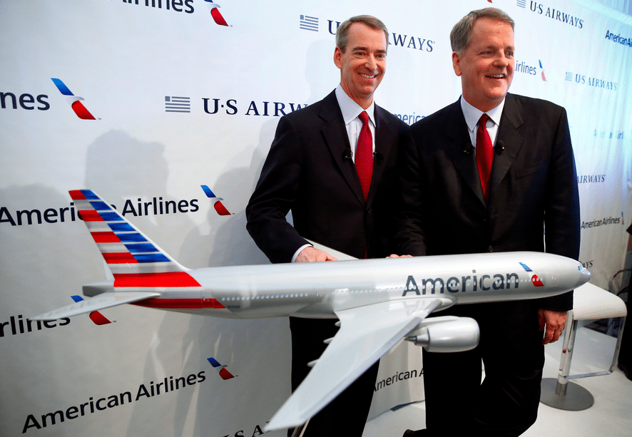 The $20 million Tom Horton smile, on the left, posing with US Airways CEO Doug Parker at the merger press conference. 
