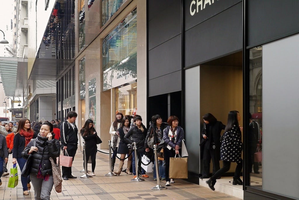Tourists from mainland China form a line outside of the Chanel store at Harbour City in March 2012. 