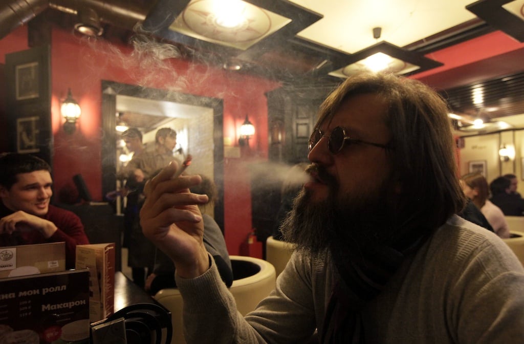 A man smokes a cigarette at a cafe in central Krasnoyarsk in Siberia January 24, 2013. 
