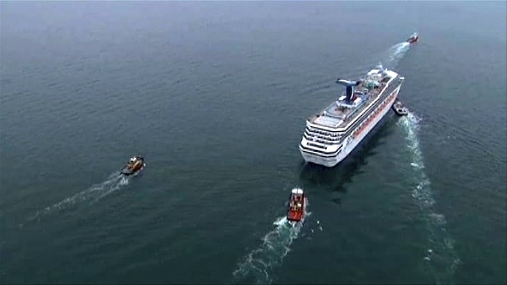 The cruise ship Carnival Triumph cruise ship is towed in this video frame grab from NBC News taken off the coast of Alabama, February 14, 2013. 