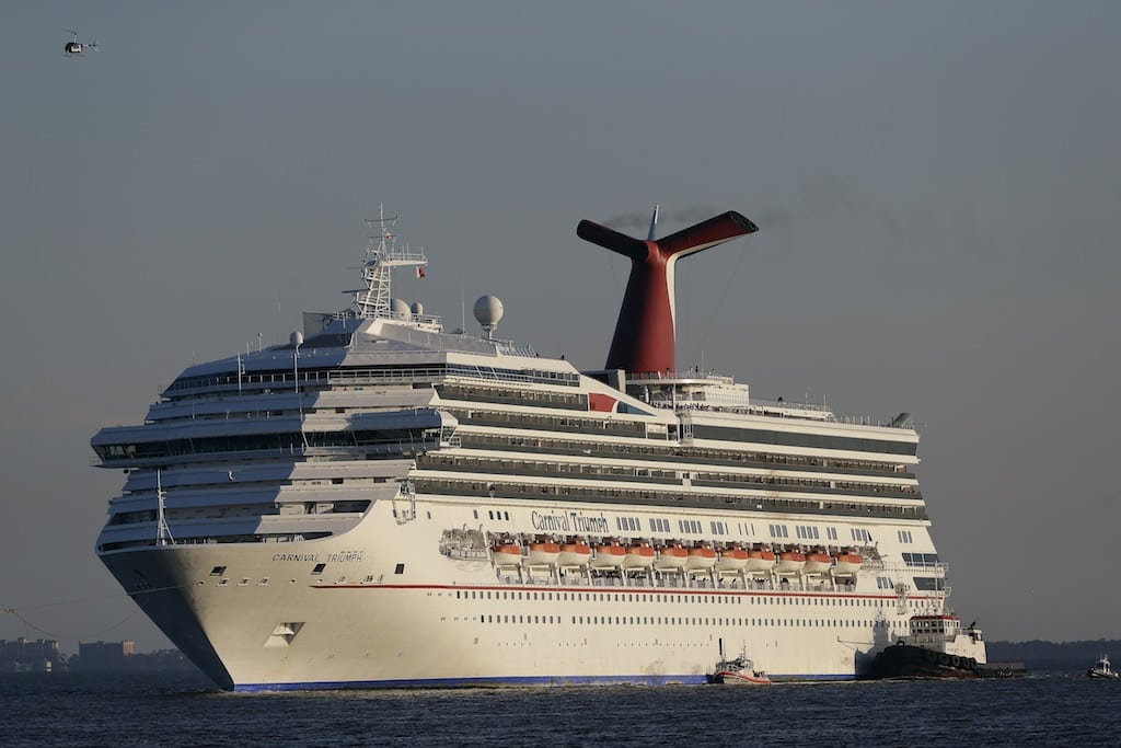 In this Feb. 14, 2013 file photo the cruise ship Carnival Triumph is towed into Mobile Bay near Dauphin Island, Ala., Thursday, Feb. 14, 2013. 