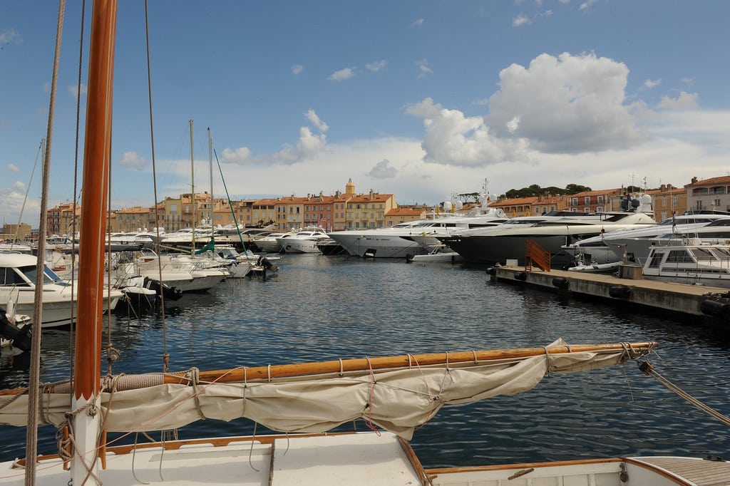 Private yachts populate the harbor in St. Tropez, France. 