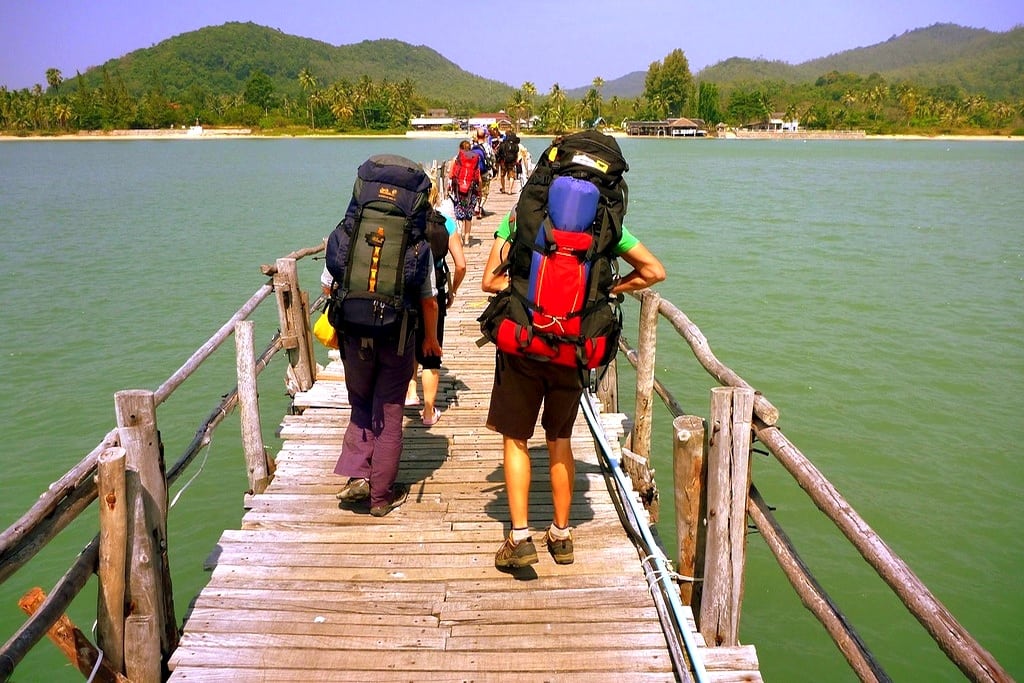 A photographer snaps a photo of travelers' backpacks on the island of Ko Tao in Thailand. 
