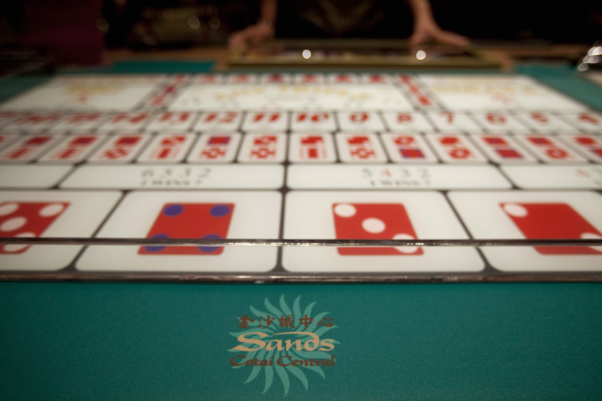 A logo of Sands is seen on a gaming table inside a casino on the opening day of the Sheraton Macao hotel at Sands Cotai Central in Macau. 
