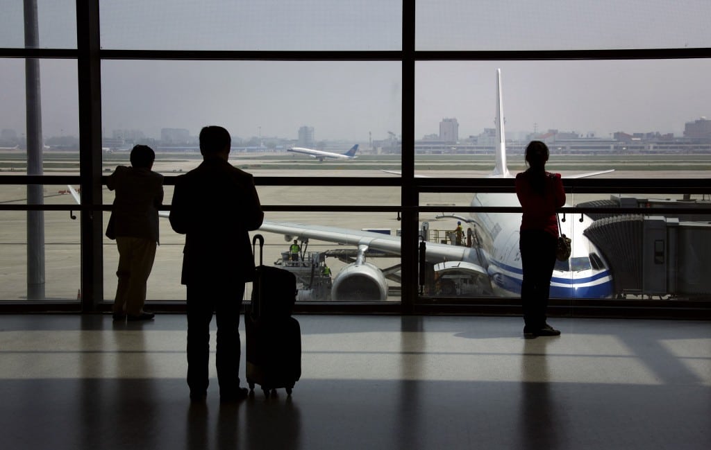 File photo of passengers watching a China Southern Airlines plane take off as they wait to board their plane at Shanghai's Hongqiao International Airport. 