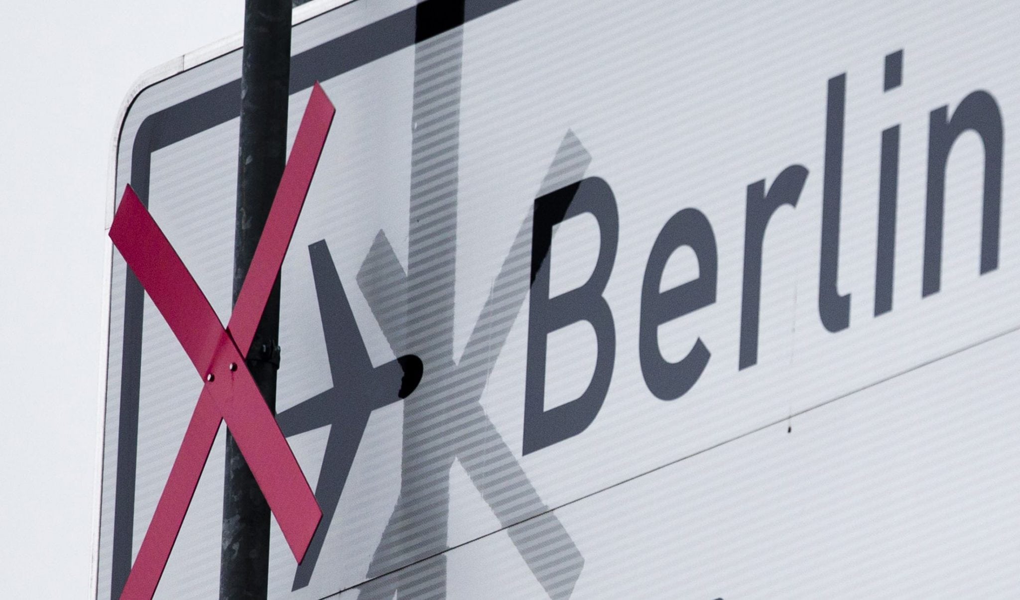 Pictogram of plane is crossed out at motorway traffic sign denoting exit to Berlin Brandenburg international airport Willy Brandt (BER) in Schoenefeld. 