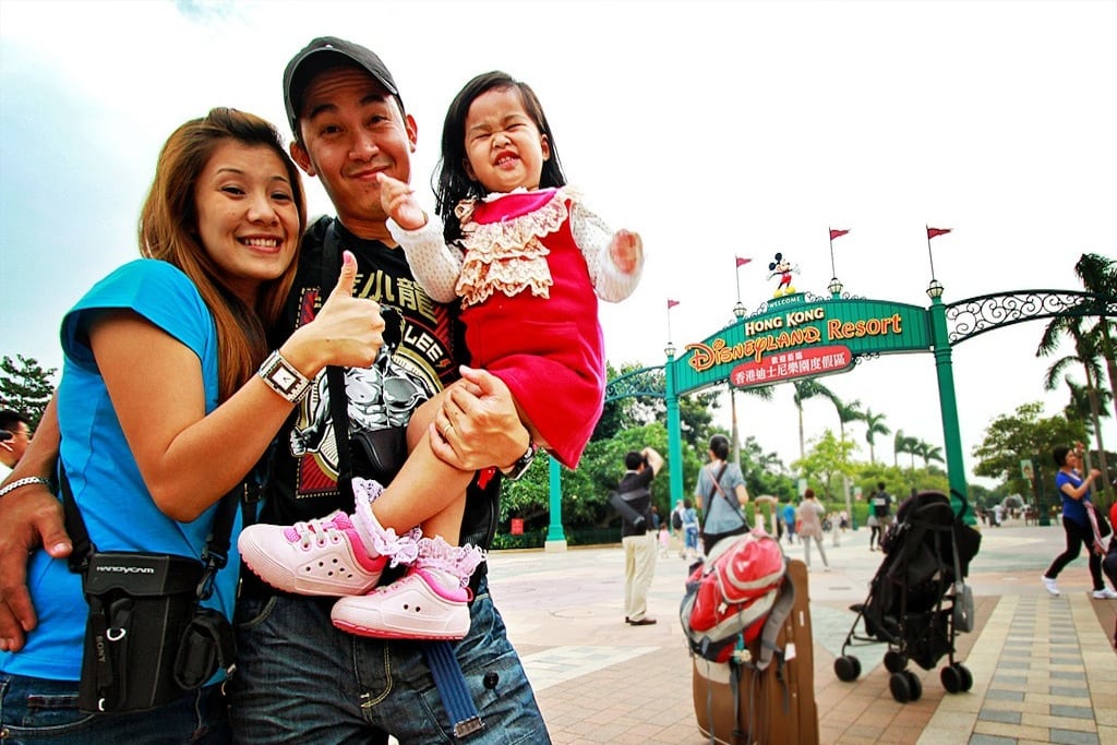 Tourists visit DisneyLand Resort in Hong Kong. 
