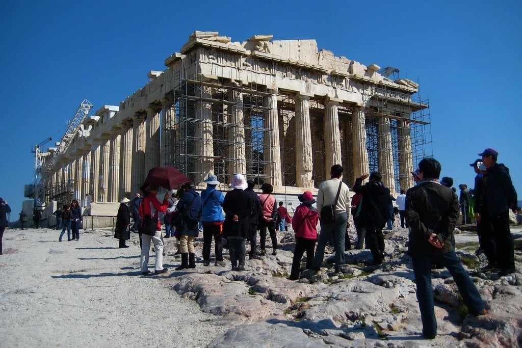 Tourists view the Acropolis in Athens, Greece. 