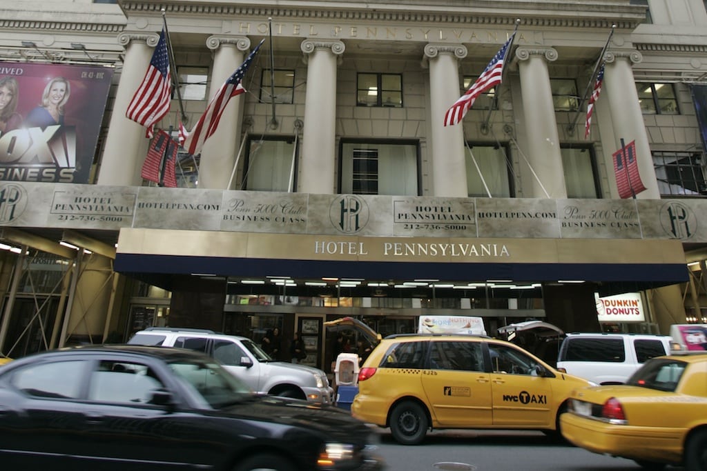  In this Feb. 9, 2008 file photo, cars pass the Hotel Pennsylvania on Seventh Ave. in New York. 