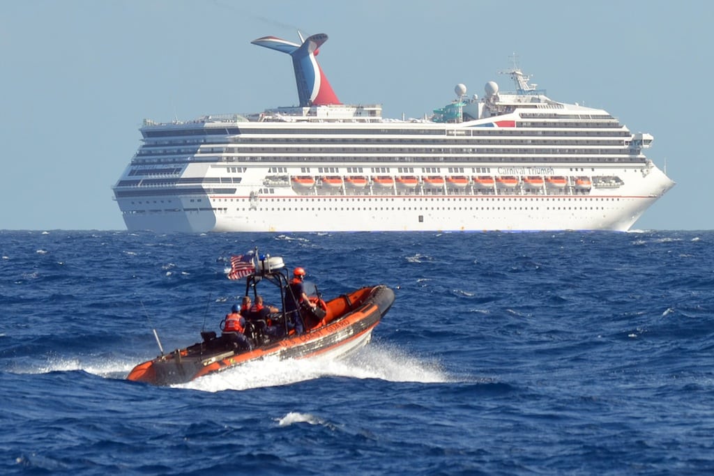 A small boat from the U.S. Coast Guard Cutter Vigorous patrols near the cruise ship Carnival Triumph in the Gulf of Mexico, in this February 11, 2013 handout photo. 