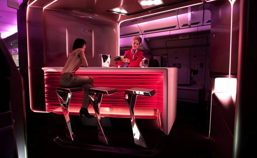 A passenger sidles up to the bar in Virgin Atlantic's Upper Class. 
