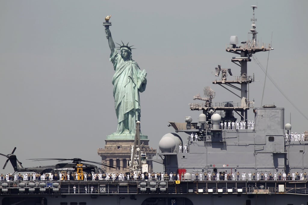 In this May 25, 2011 file photo, sailors stand on the deck of the USS Iwo Jima as it passes by the Statue of Liberty to kick off Fleet Week in New York.  