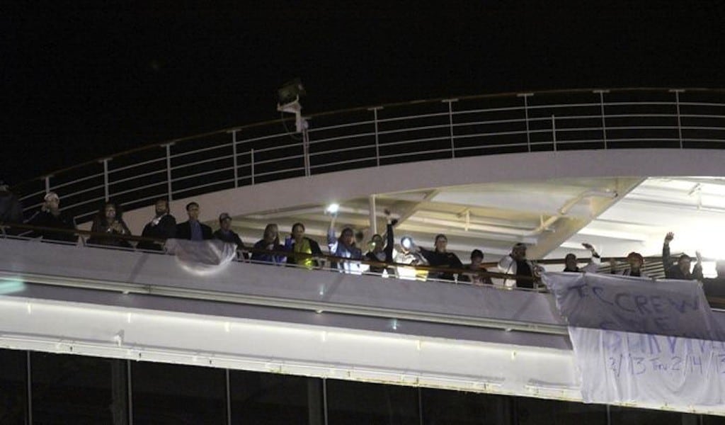 Carnival Triumph passengers wait to debark in the port of Mobile, Alabama, February 14. 