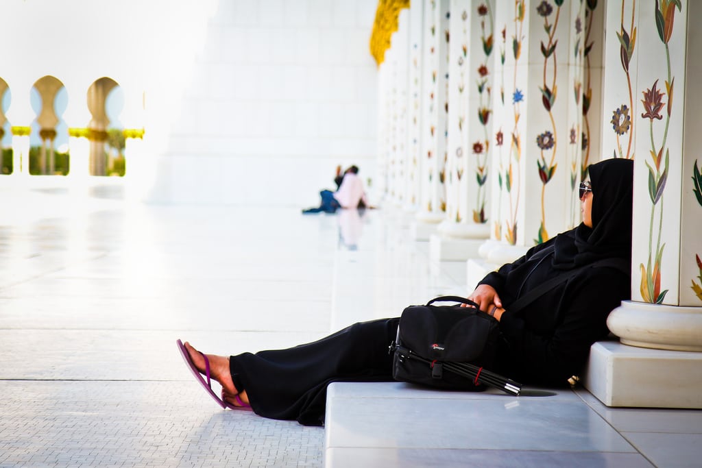 A woman relaxes at the Sheikh Zayed Mosque in Abu Dhabi. 