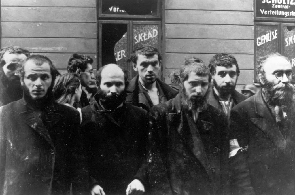 In this April/May 1943 file photo, a group of religious Jews are being held under arrest by German SS soldiers during the destruction of the Warsaw Ghetto by German troops, following an uprising in the Jewish quarter.  