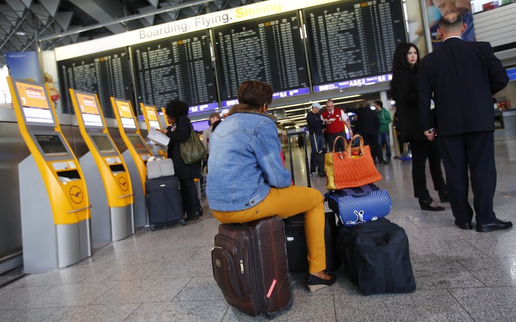 Passengers are seen in an airport hall during the warning strike of German air carrier Lufthansa ground personnel at the Fraport airport in Frankfurt, April 22, 2013. 