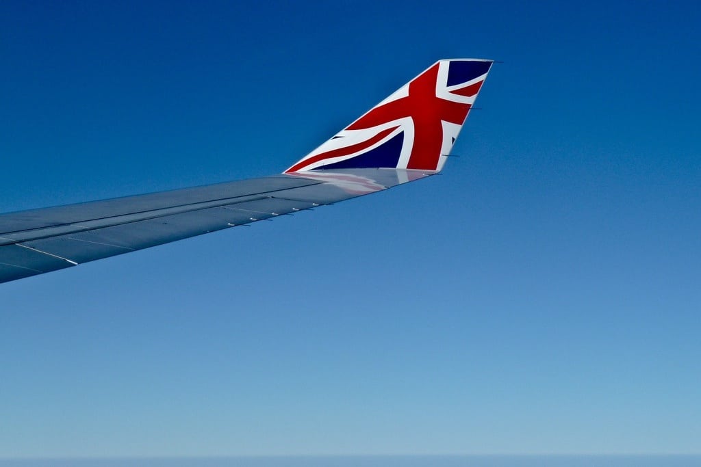 The wing of a British Airways flight as from inside the cabin. 