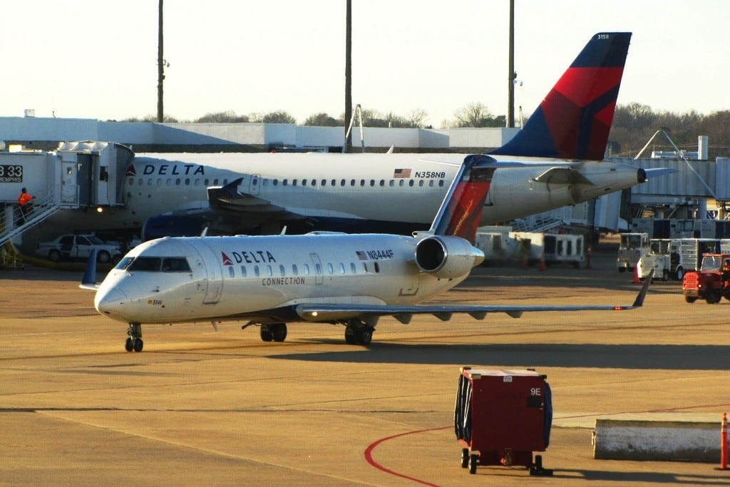 Delta Air Lines Airbus A319 and a small Pinnacle Airlines Bombardier flying for Delta at Memphis International Airport. 