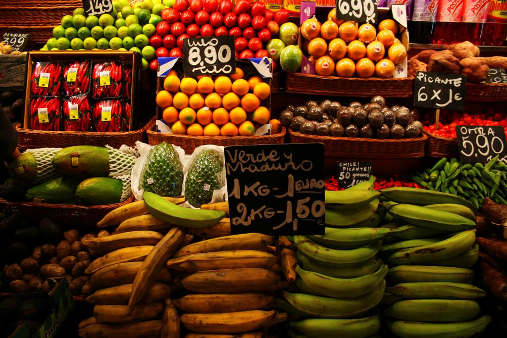 Tourists flock to Barcelona's famous fruit and meat markets on Las Ramblas. 