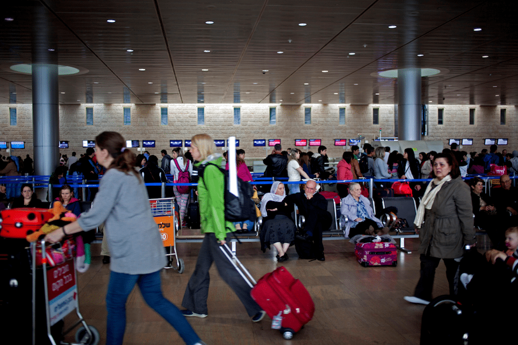Passengers wait in a departure hall at the Ben Gurion airport near Tel Aviv, Israel, Sunday, April 21, 2013. 