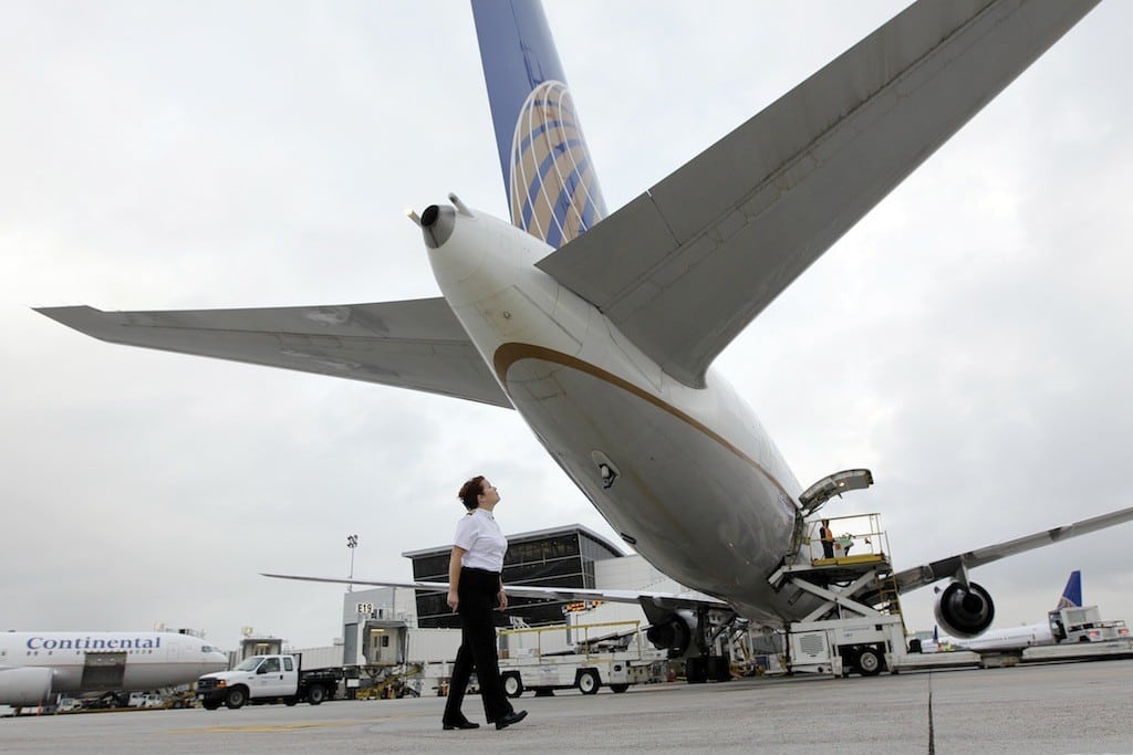 In this April 16, 2010 file photo, Continental Airlines First Officer Pamela Perdue conducts a pre-flight inspection of a 767 airplane at George Bush Intercontinental Airport Friday in Houston. United Continental reports quarterly financial results before the market opens on Thursday, April 25, 2013.
