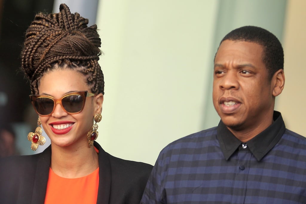 U.S. singer Beyonce (L) and her husband rapper Jay-Z walk as they leave their hotel in Havana April 4, 2013.