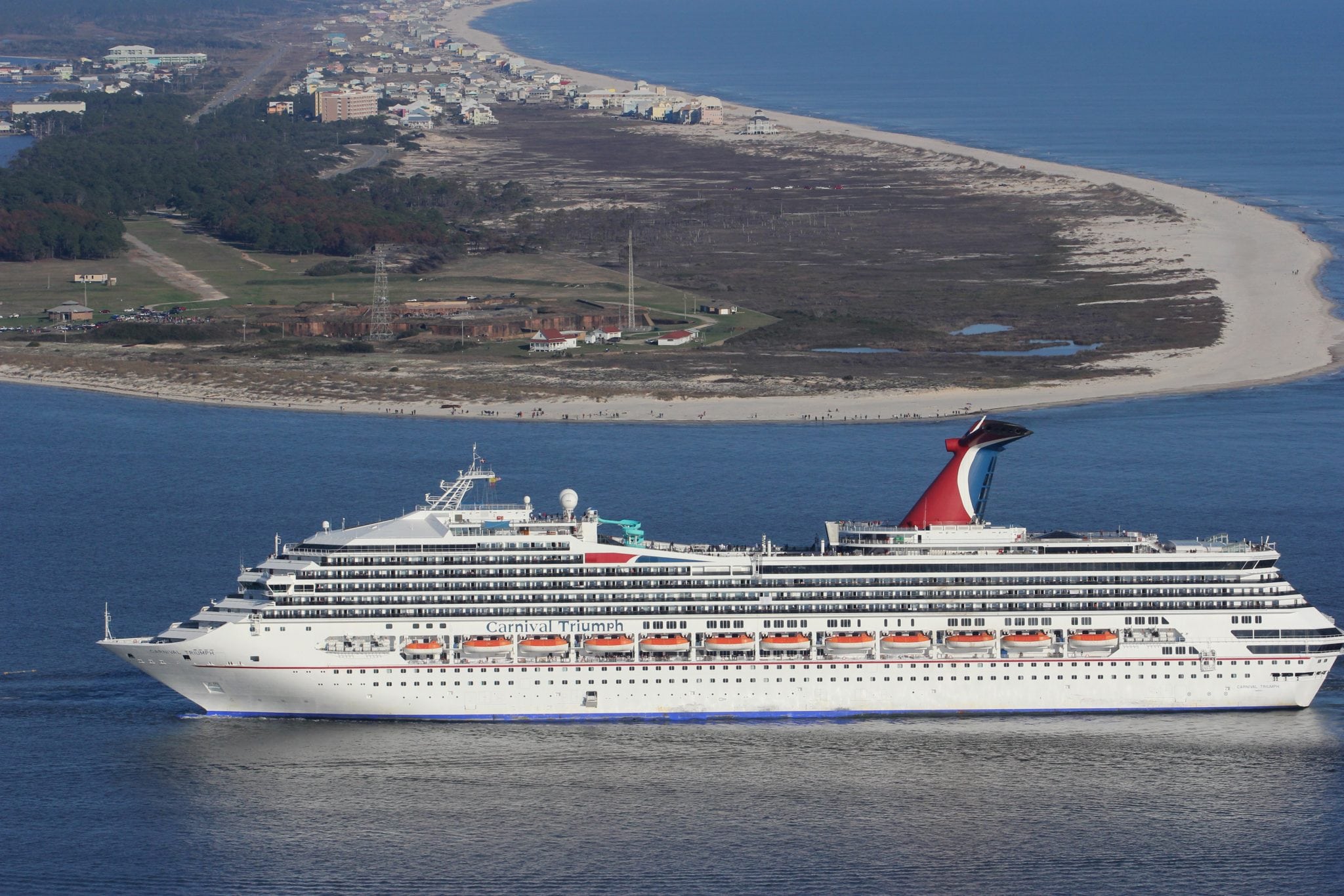 The Carnival Triumph cruise ship is towed towards the port of Mobile. 