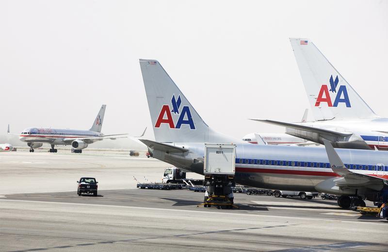 American Airlines aircraft stand on the tarmac at Los Angeles International Airport. 