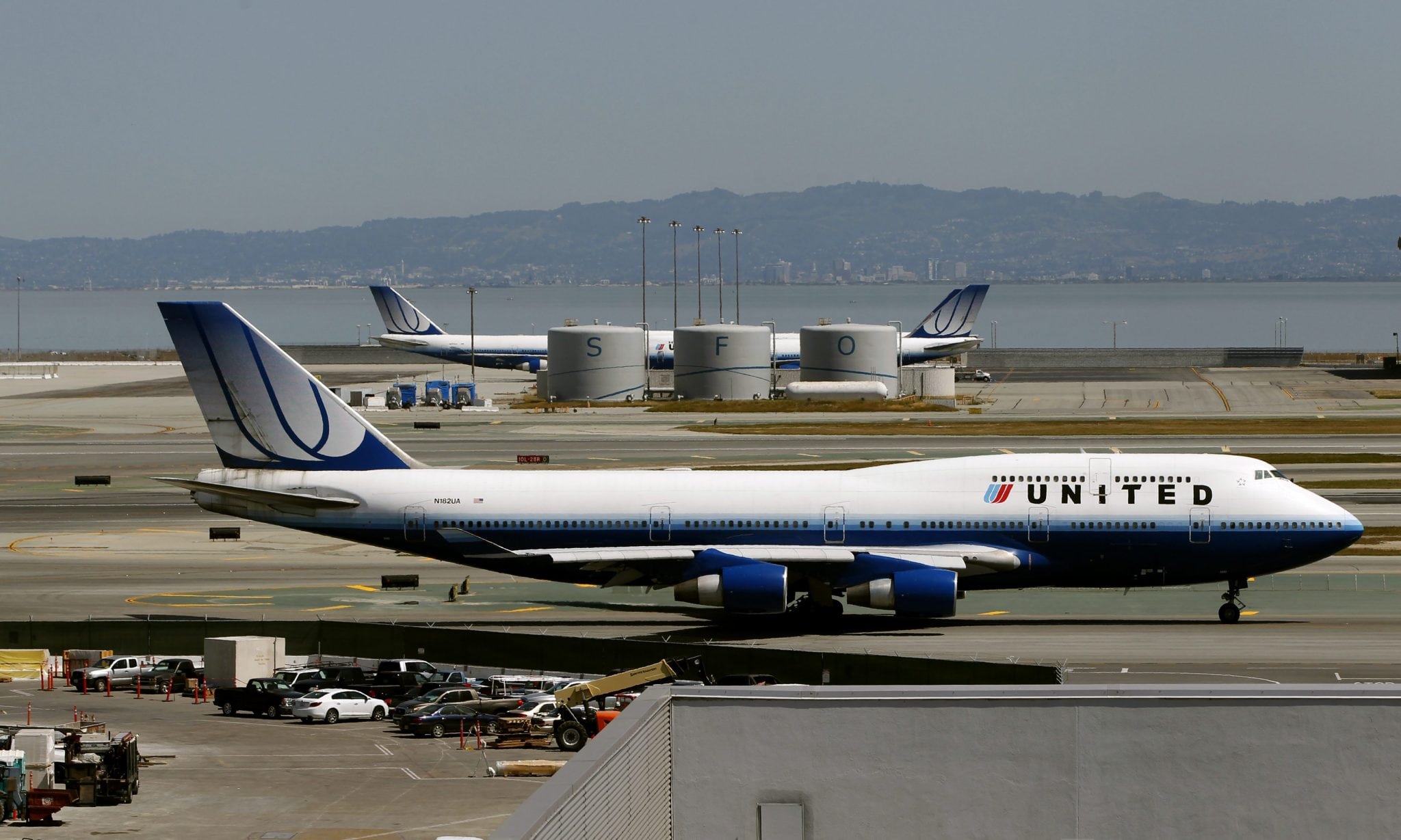 A United Airlines passenger jet taxis to a runway at San Francisco International Airport in San Francisco. 