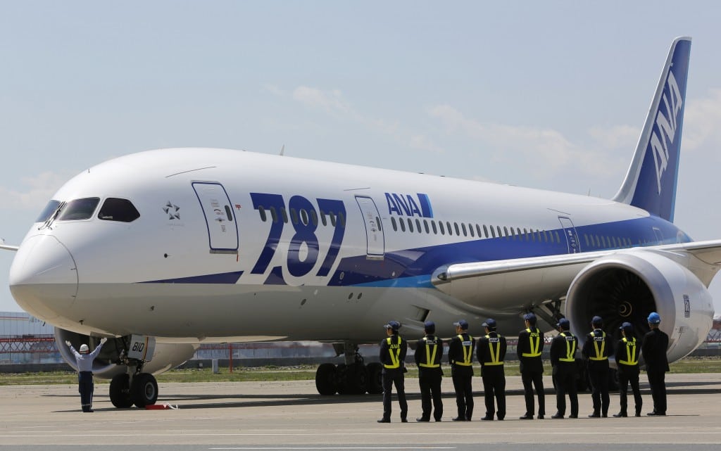 Employees of All Nippon Airways queue in front of the company's Boeing 787 Dreamliner plane after its test flight at Haneda airport in Tokyo . 