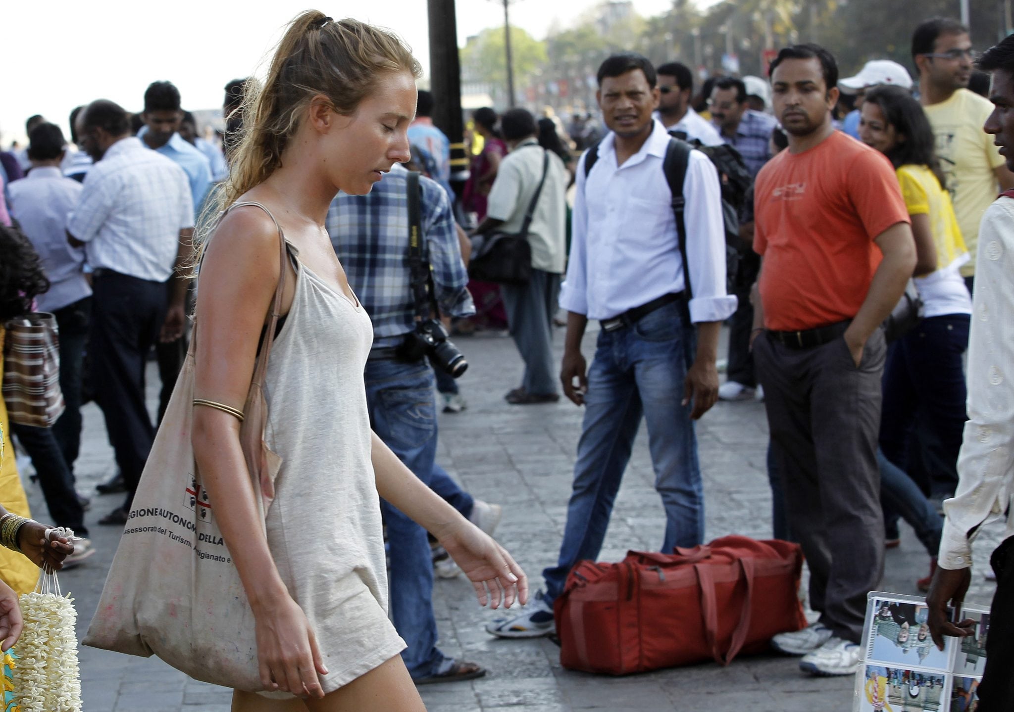 German tourist Carolina De Paola, 22, walks near the landmark Gateway of India in Mumbai, India. 