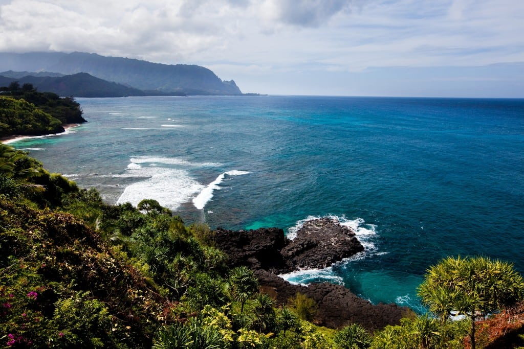 The Kaua'i cliffs look over pristine ocean in Hawaii. 