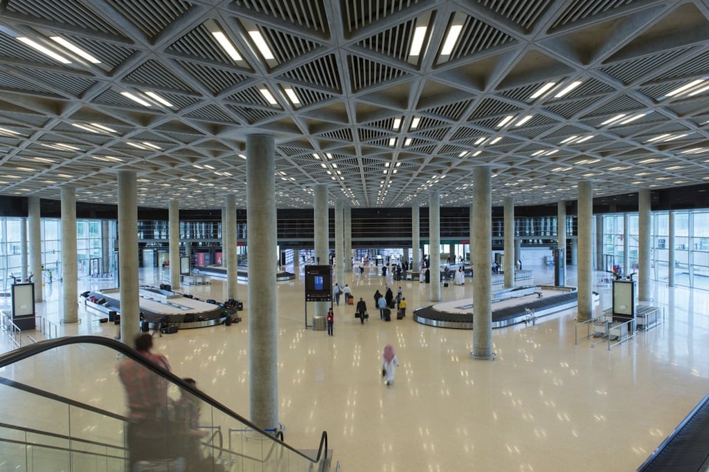 Passengers walk through the new terminal at Queen Alia International Airport in Amman, Jordan. 