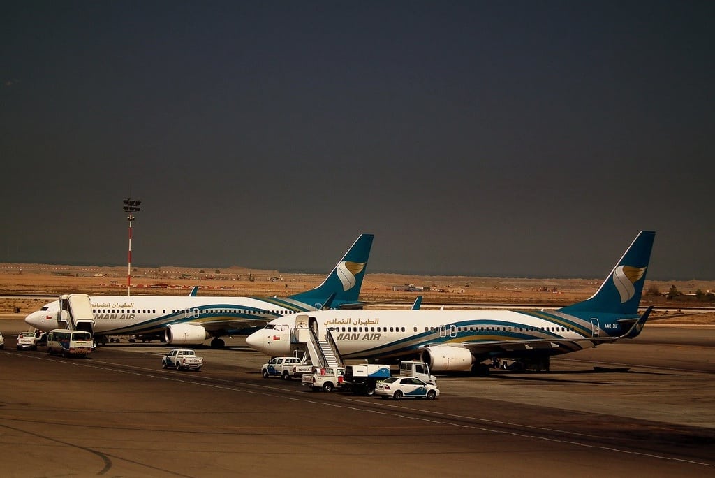 Oman Air Boeing 737 hets sit at Muscat Seeb Airport in Oman. 
