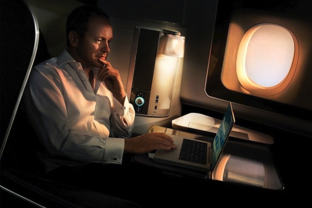 A British Airways passengers look at his laptop in the first-class cabin. 