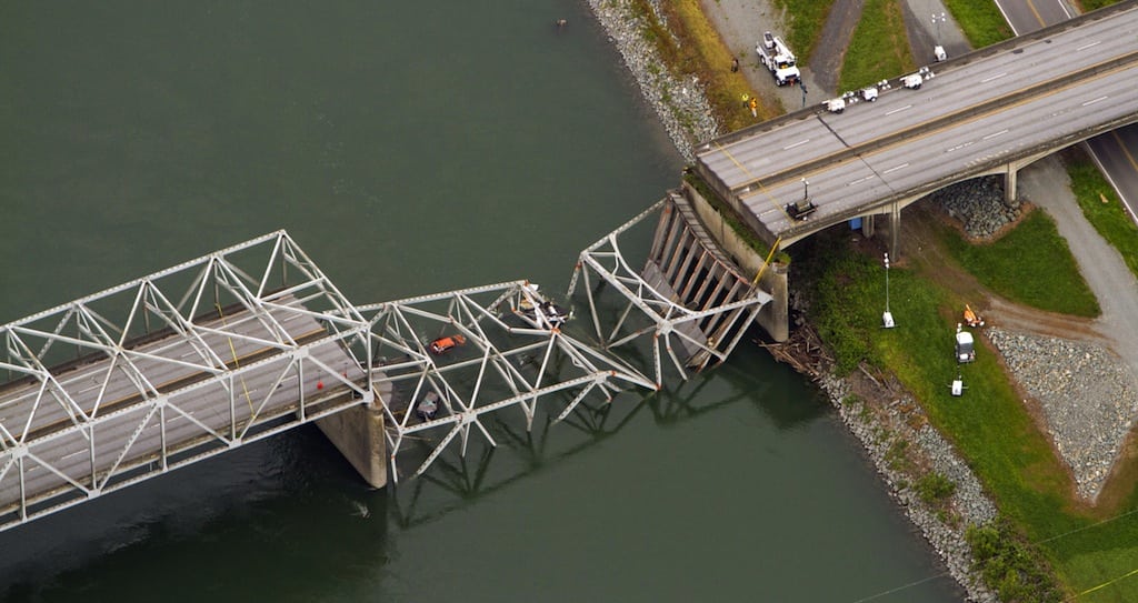 A collapsed section of the Interstate 5 bridge over the Skagit River in Washington State is seen in an aerial view Friday, May 24, 2013. Part of the bridge collapsed Thursday evening, sending cars and people into the water when a an oversized truck hit the span, the Washington State Patrol chief said. Whatcom Counties.  