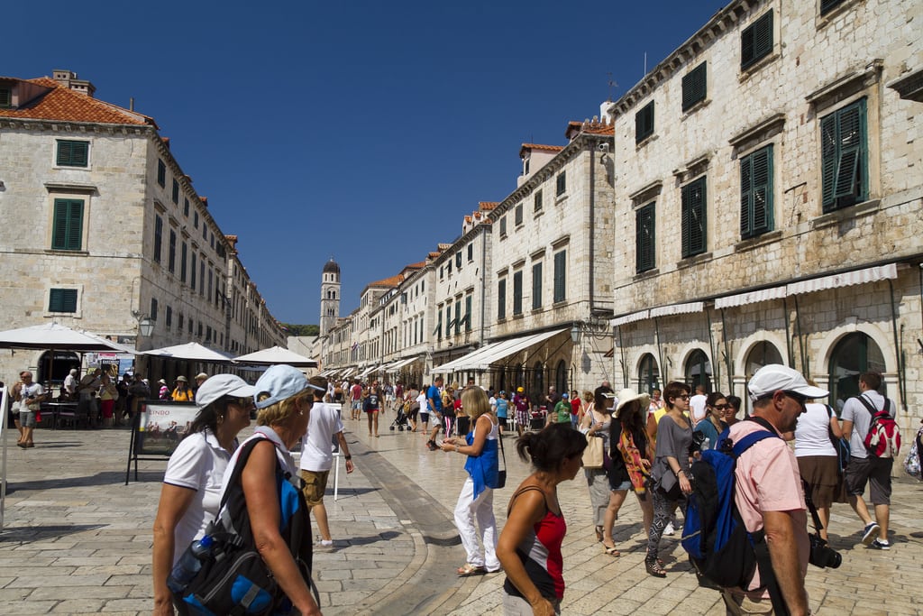 Tourists walk through the walled old town of Dubrovnik. 