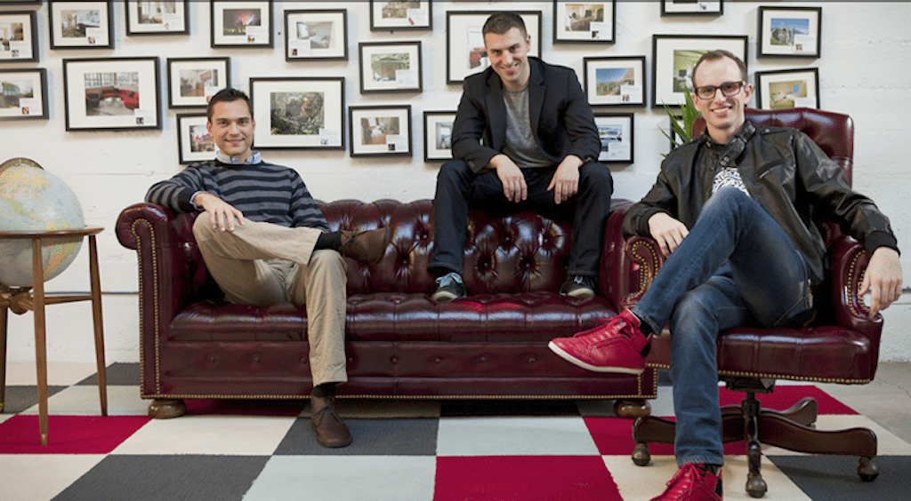 Airbnb CEO Brian Chesky (center) with fellow co-founders Nathan Blecharczyk (left) and Joe Gebbia. No, they are not couch-surfing. 