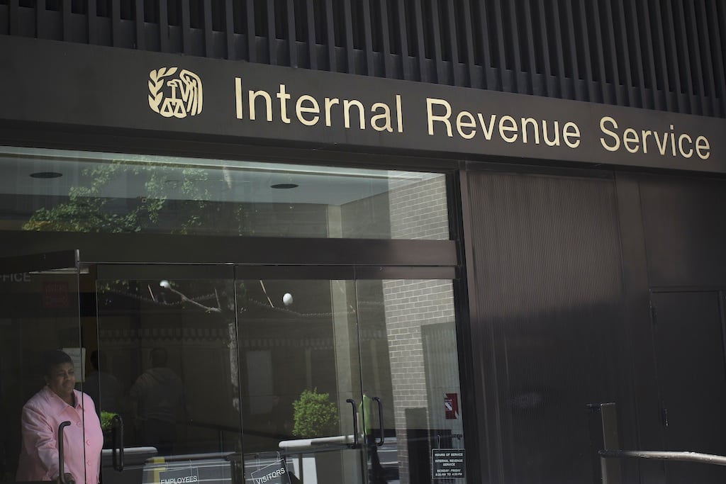 A woman walks out of the Internal Revenue Service building in New York in this May 13, 2013 photo.  