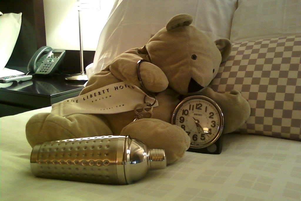 Boston's Liberty Hotel leaves a surprise for travelers alongside an alarm clock. 