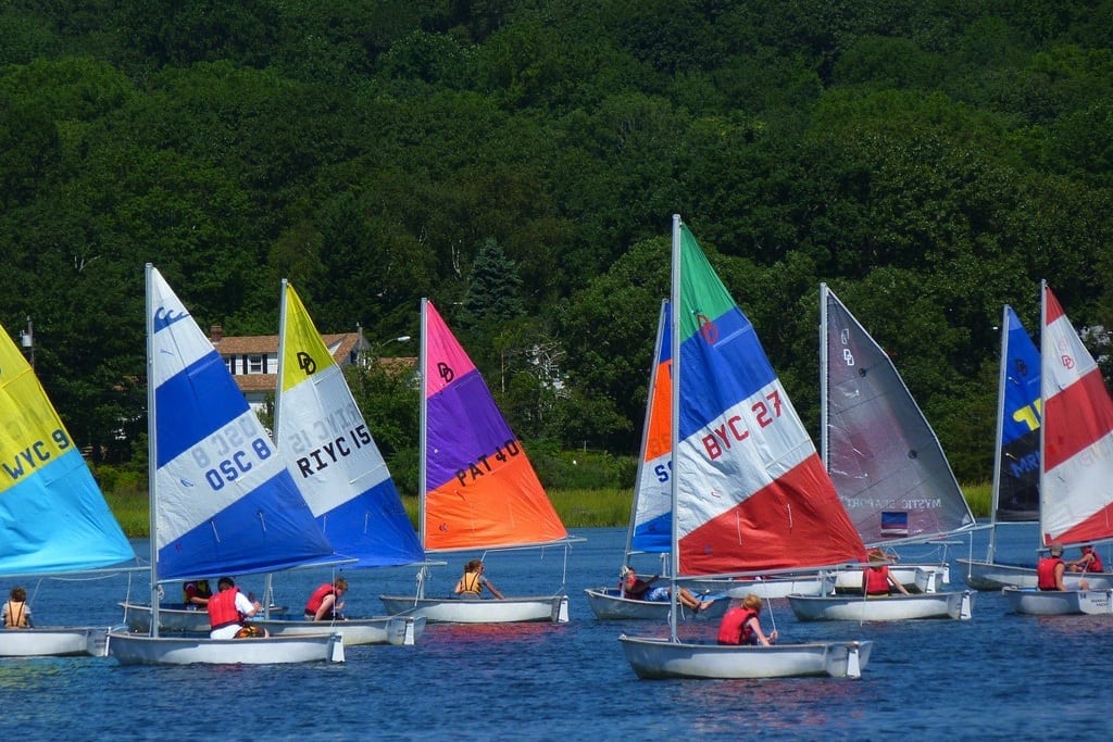 Sail boats race on the river near Mystic, Connecticut. 