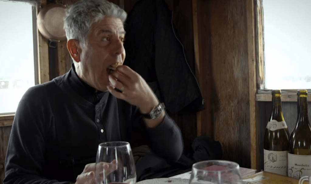 Bourdain enjoys a gourmet meal atop three feet of ice covering the St. Lawrence River. 