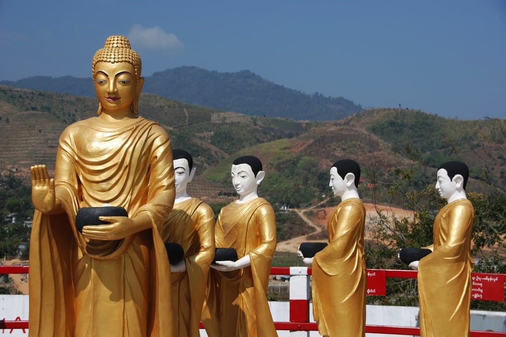 Buddhist statues close to the Golden Pagoda in Thachilek, Myanmar.