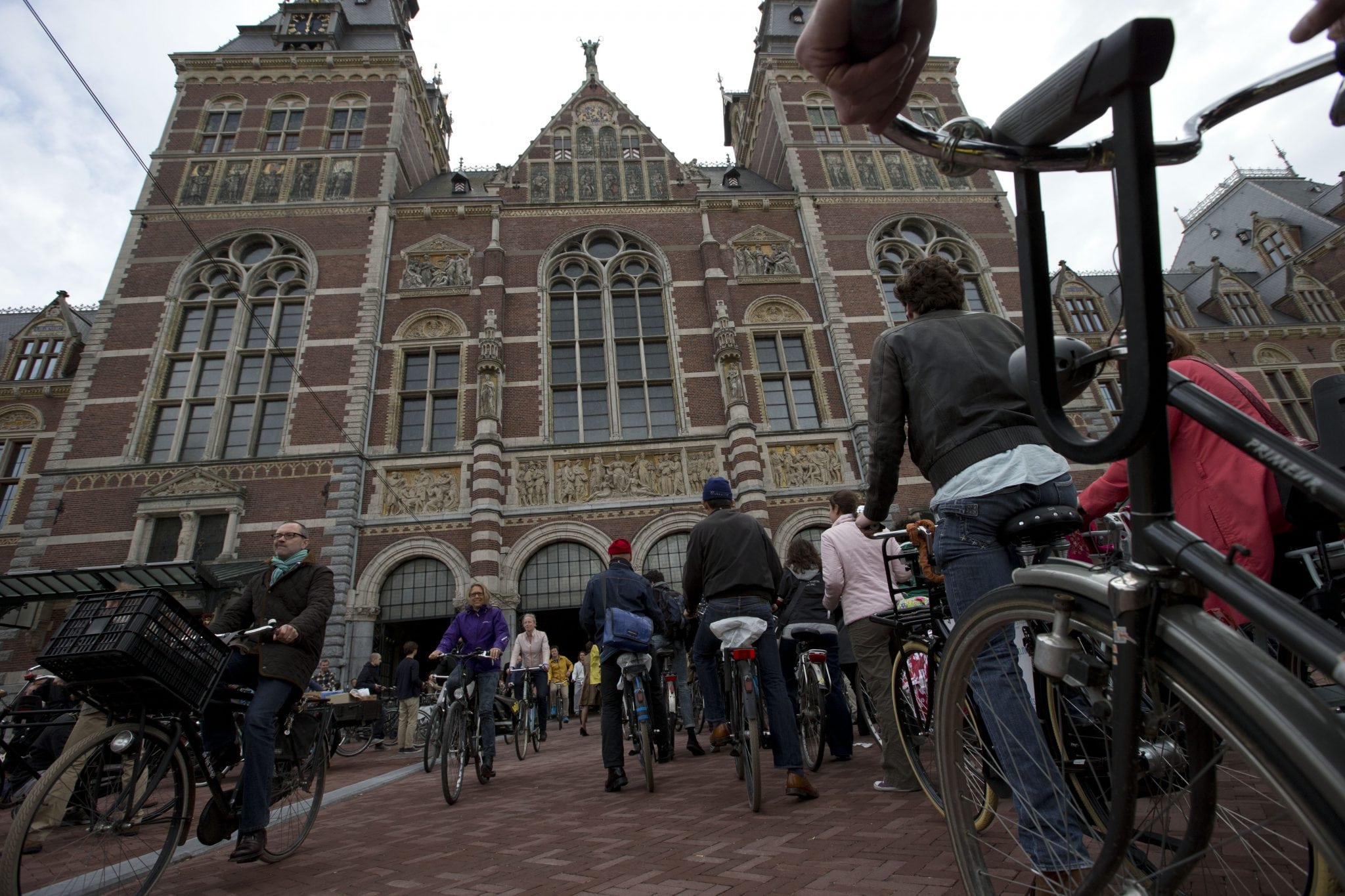 Hundreds of bicycles queue to pass through Rijksmuseum, in Amsterdam, Netherlands, Monday May 13, 2013, signaling the end of more than a decade of efforts by cyclists to ensure a passageway that runs under and through the Rijksmuseum would remain open to bike traffic. 