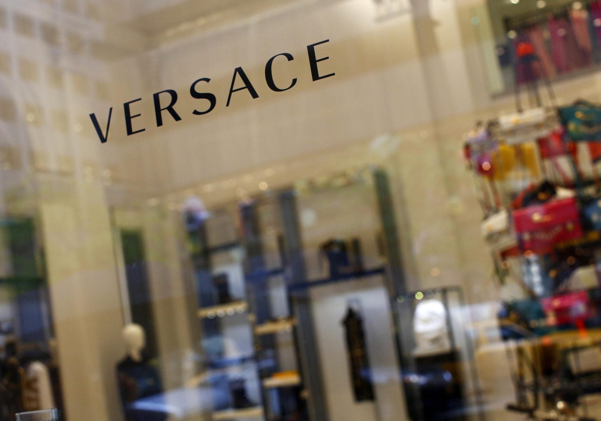 A sign is seen for high-end retail store Versace along 5th Avenue in New York May 19, 2013.
