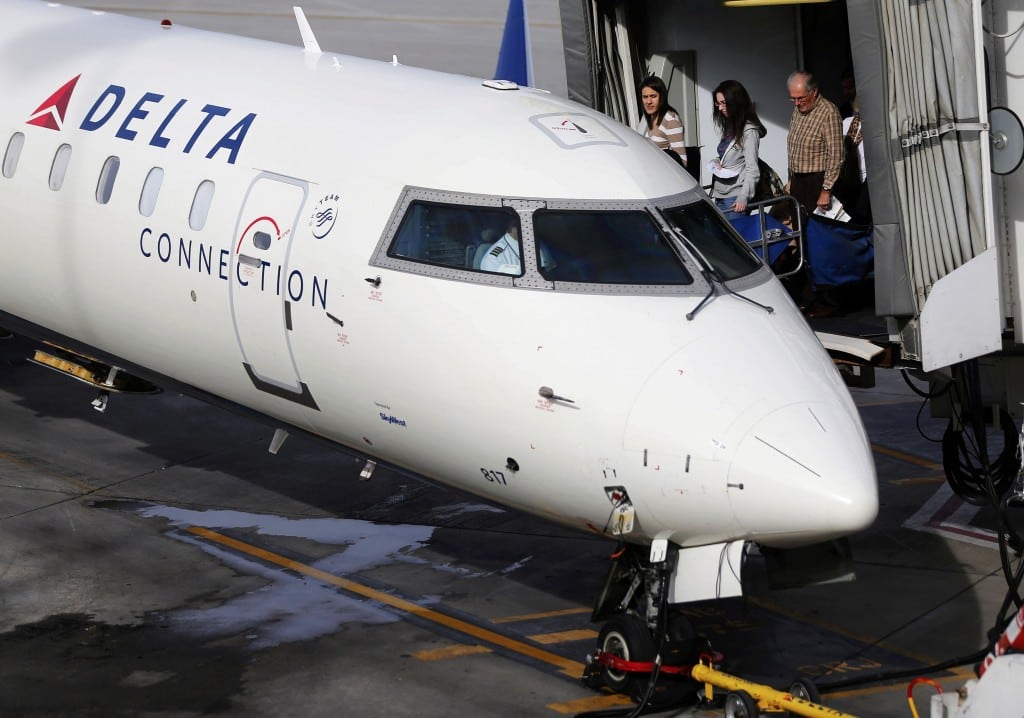 Passengers board a Delta plane a day before the annual Thanksgiving Day holiday at the Salt Lake City international airport in Salt Lake City, Utah November 21, 2012. 